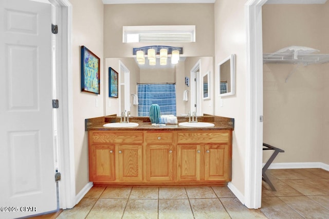 bathroom featuring tile patterned flooring, vanity, and a shower with shower curtain