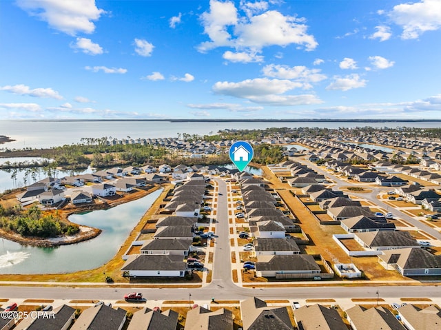 bird's eye view featuring a residential view and a water view