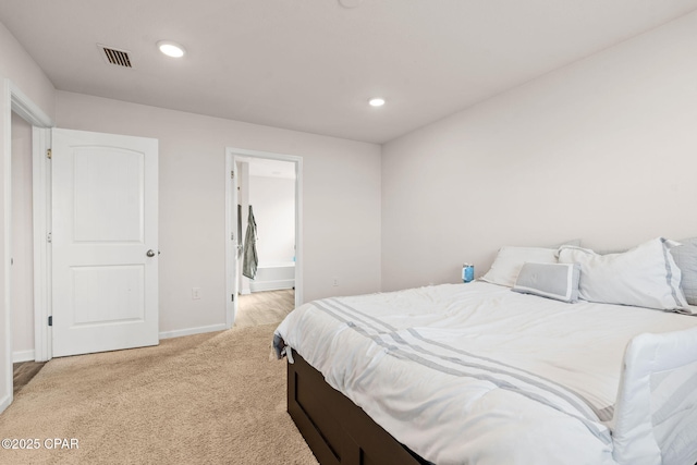 bedroom featuring baseboards, visible vents, ensuite bath, recessed lighting, and light carpet