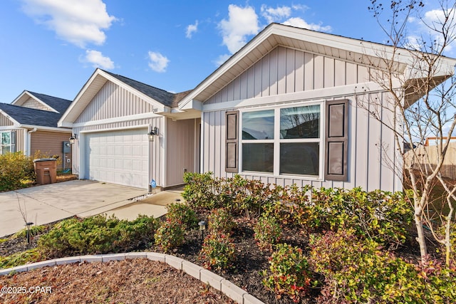 ranch-style house with a garage, board and batten siding, and concrete driveway