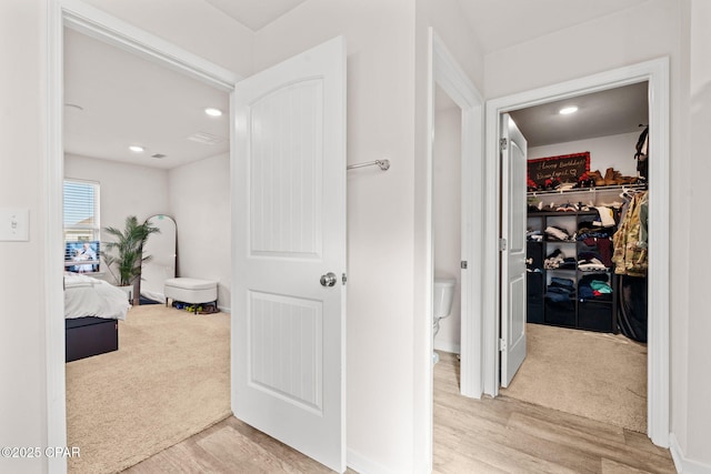 hallway featuring recessed lighting and wood finished floors