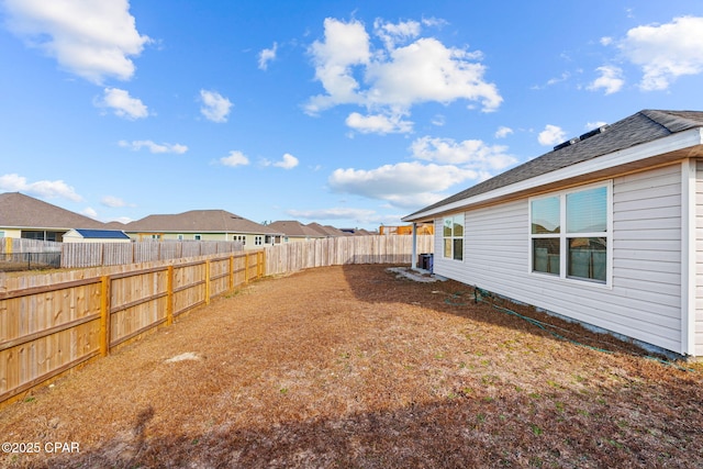 view of yard featuring a residential view and a fenced backyard