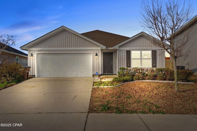 ranch-style house with board and batten siding, concrete driveway, and a garage