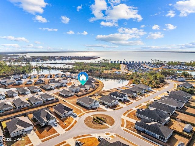 bird's eye view with a residential view and a water view