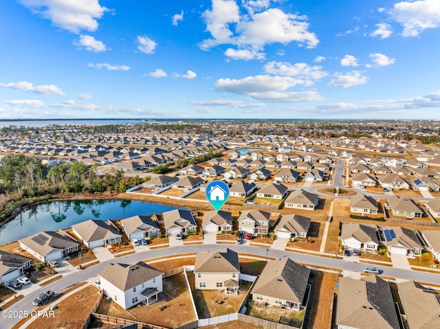 birds eye view of property featuring a residential view and a water view