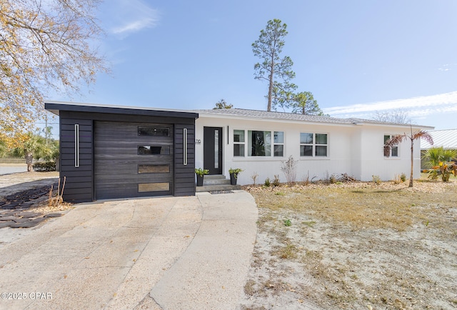 single story home featuring a garage