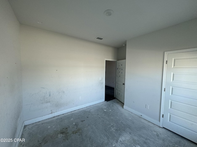 unfurnished bedroom featuring concrete floors