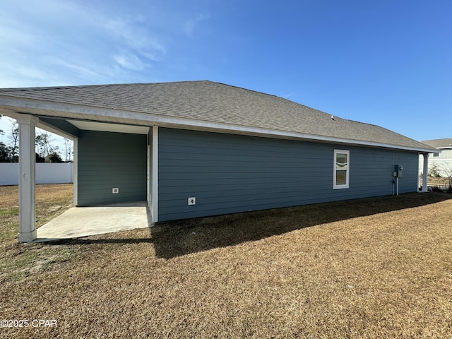 view of property exterior with a patio area