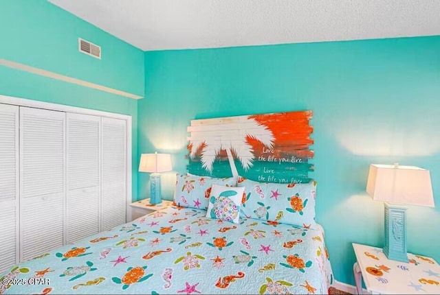 bedroom featuring a closet and a textured ceiling