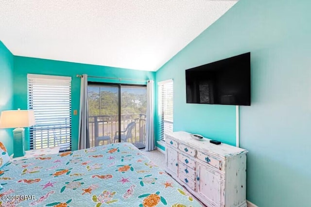 carpeted bedroom with access to outside, a textured ceiling, and vaulted ceiling