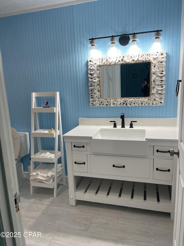 bathroom with vanity and toilet