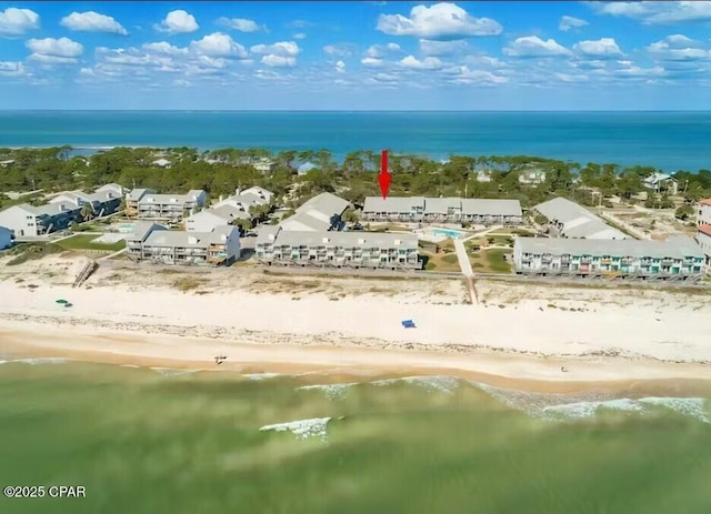 birds eye view of property featuring a water view and a view of the beach