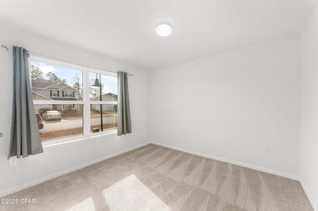 unfurnished room featuring carpet flooring