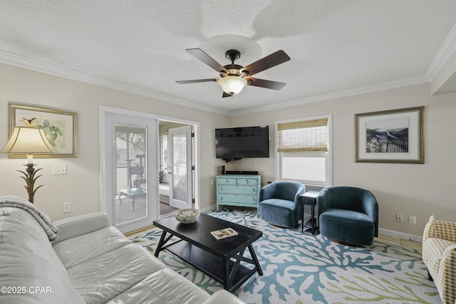 living room featuring hardwood / wood-style flooring, crown molding, ceiling fan, and a textured ceiling