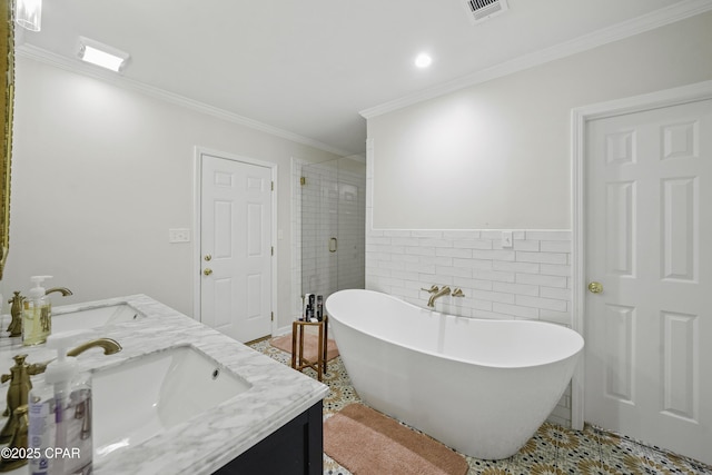 bathroom featuring vanity, separate shower and tub, tile walls, and crown molding