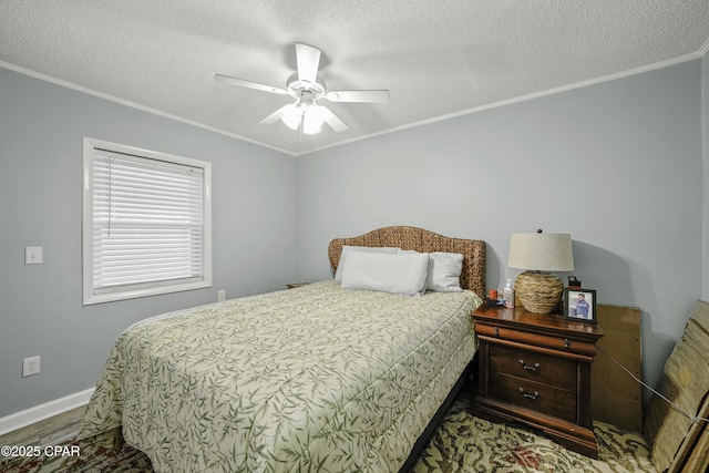 bedroom with crown molding, hardwood / wood-style floors, ceiling fan, and a textured ceiling