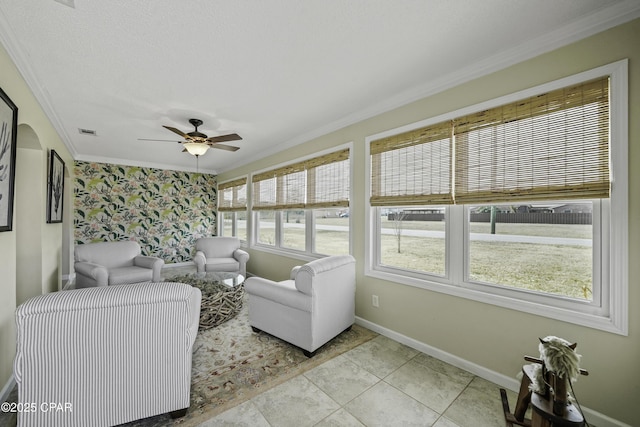 living room featuring crown molding, ceiling fan, and light tile patterned floors