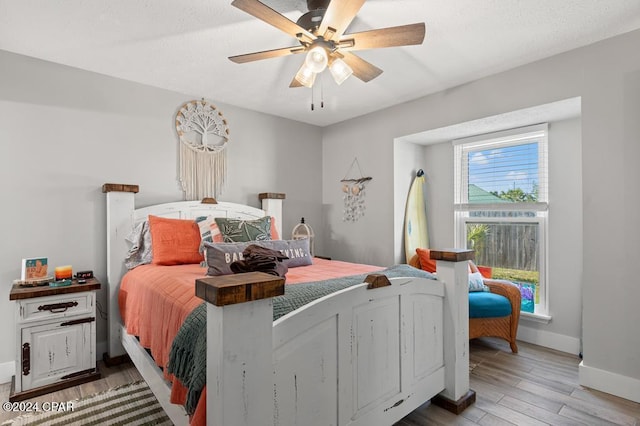 bedroom featuring hardwood / wood-style floors and ceiling fan