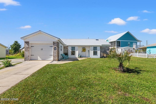 ranch-style home with a garage and a front yard