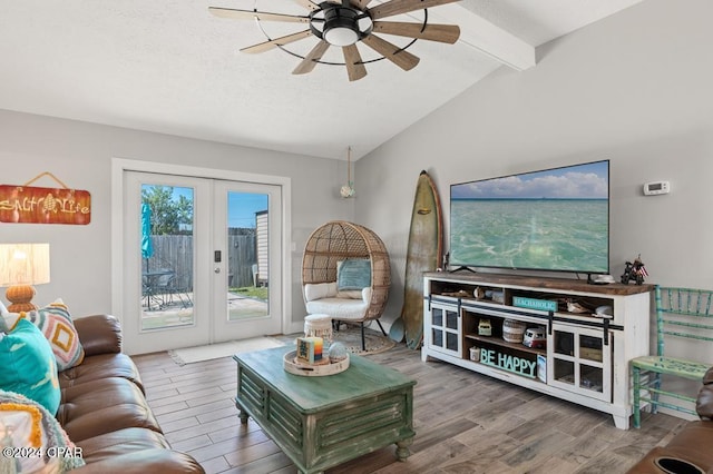 living room featuring hardwood / wood-style floors, beam ceiling, french doors, and ceiling fan