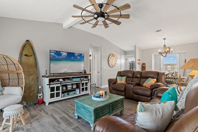 living room with vaulted ceiling with beams, ceiling fan with notable chandelier, and wood-type flooring