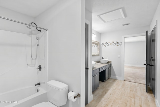 full bath with double vanity, visible vents, toilet, wood finished floors, and shower / bathtub combination