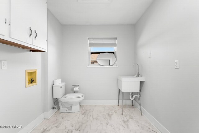 3531 Florida Ave, Panama City, FL 32405 - half bath with marble finish flooring, toilet, and baseboards