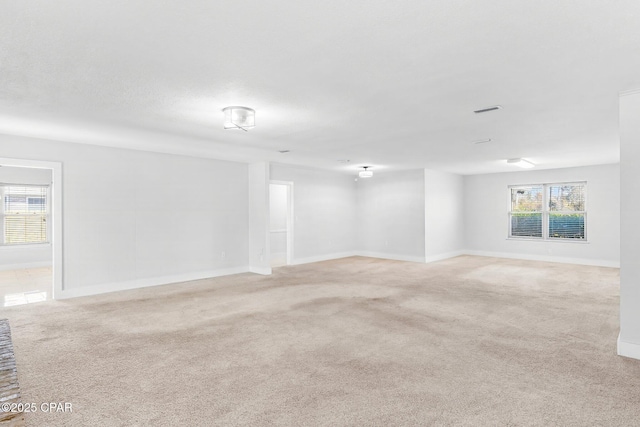 empty room featuring light carpet