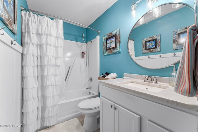 full bathroom with vanity, toilet, and shower / tub combo