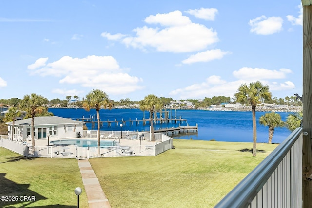exterior space featuring a patio, a water view, a community pool, and a lawn