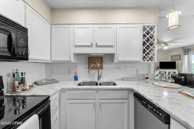 kitchen with white cabinetry, sink, light stone counters, and black appliances