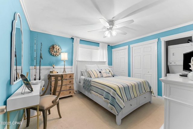 bedroom with light carpet, two closets, and crown molding