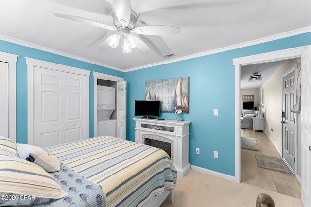 bedroom with ornamental molding and ceiling fan
