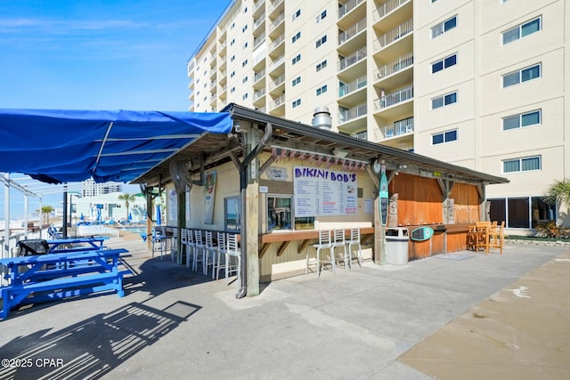 view of home's community with outdoor dry bar