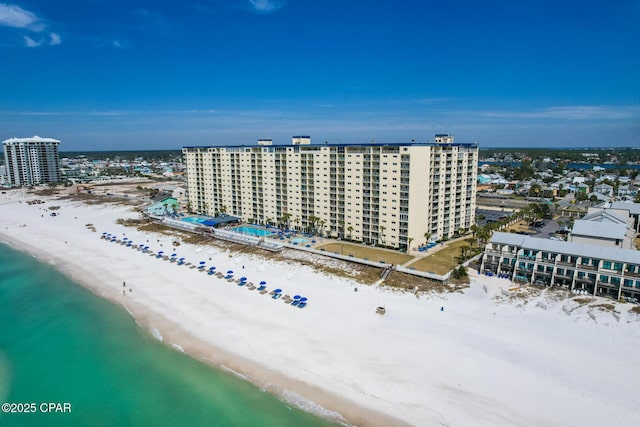 birds eye view of property featuring a city view, a beach view, and a water view