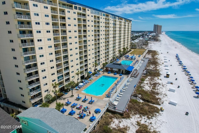 aerial view with a water view and a beach view