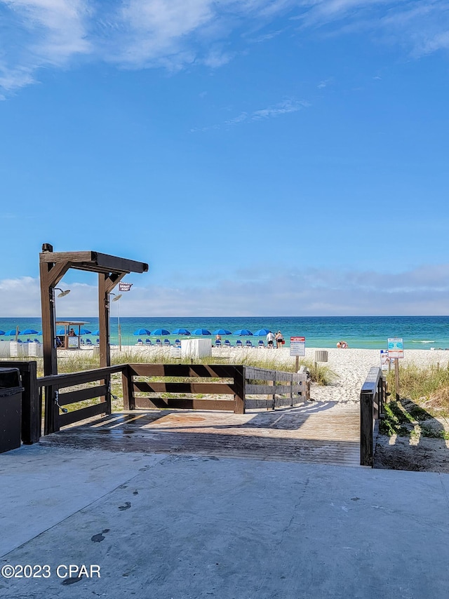 property view of water featuring a beach view