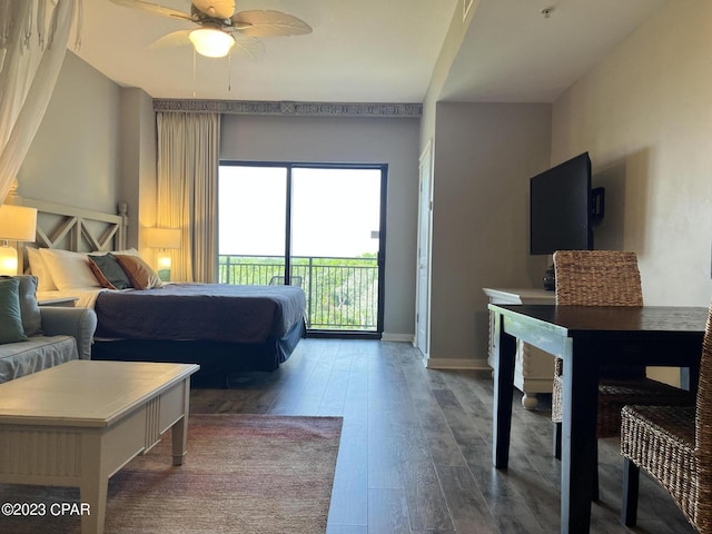 bedroom with access to exterior, a ceiling fan, baseboards, and dark wood-style flooring