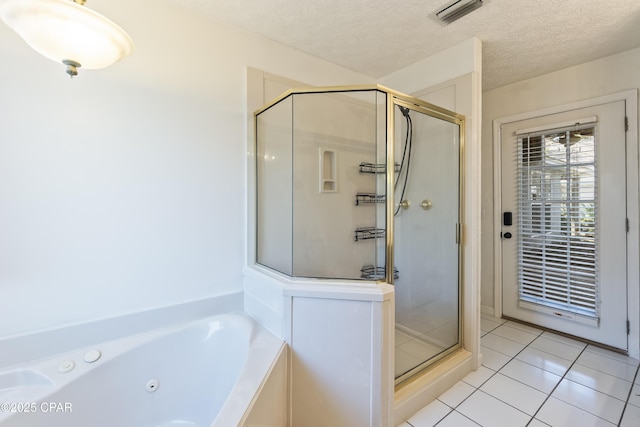 bathroom with a shower stall, tile patterned floors, visible vents, and a tub with jets