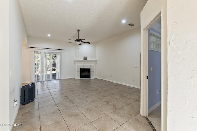 unfurnished living room with recessed lighting, light tile patterned floors, visible vents, ceiling fan, and a tile fireplace