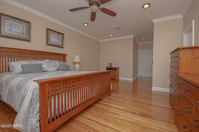 bedroom featuring ornamental molding, ceiling fan, and light hardwood / wood-style floors