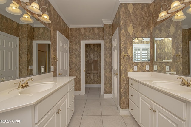 bathroom with tile patterned flooring, ornamental molding, a notable chandelier, and vanity