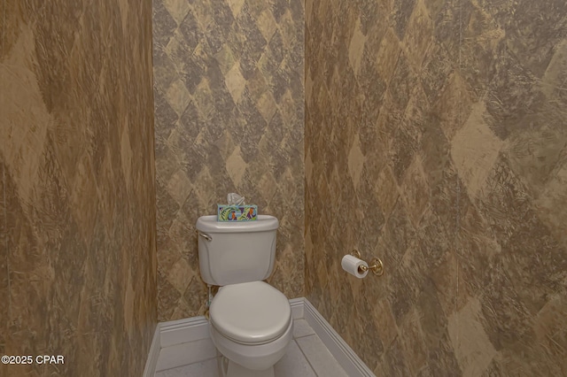 bathroom featuring tile patterned floors and toilet