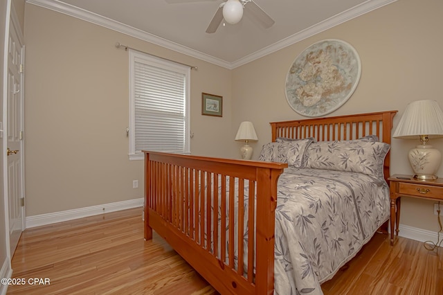 bedroom with crown molding, ceiling fan, and light wood-type flooring