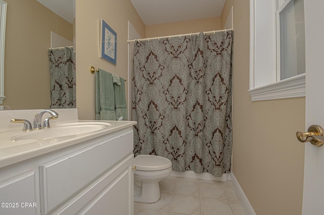 bathroom with vanity, toilet, and tile patterned flooring