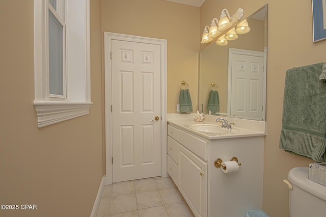 bathroom featuring vanity, tile patterned floors, and toilet