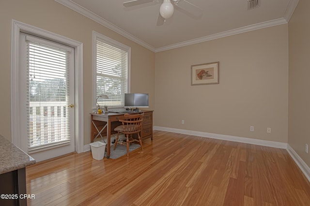 home office featuring ceiling fan, ornamental molding, and light hardwood / wood-style floors