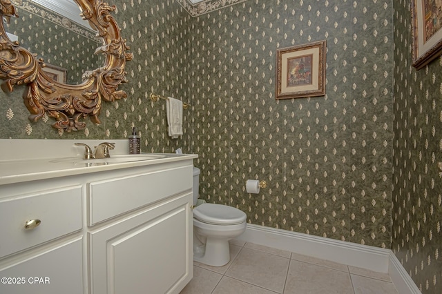 bathroom with vanity, tile patterned floors, and toilet