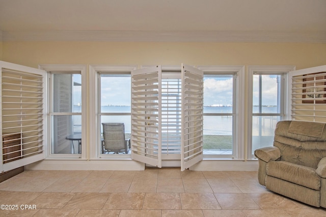 unfurnished sunroom featuring a water view