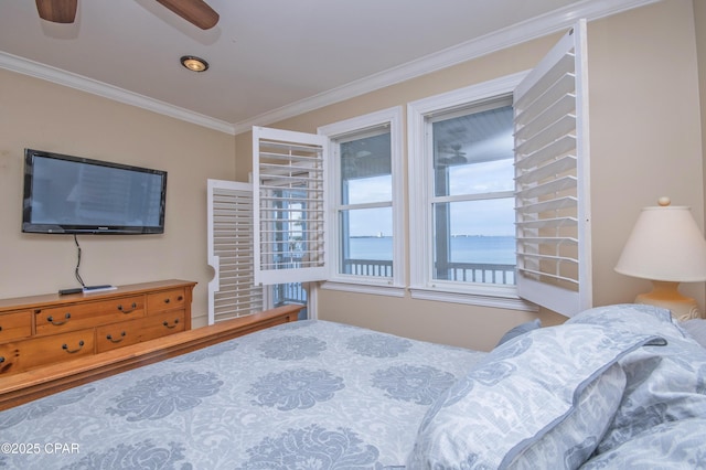 bedroom featuring a water view, ceiling fan, and ornamental molding